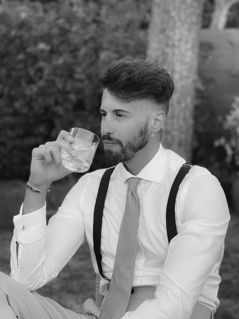 Walter at a garden table, shirt and braces