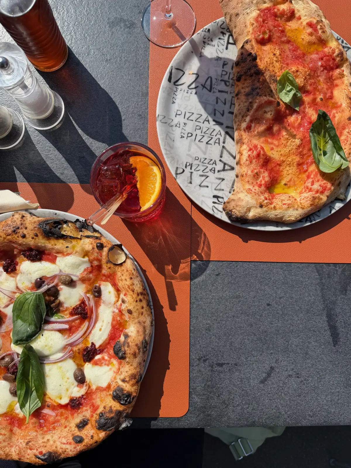 Pizzas on an outdoor table at Edi’s on Schaffhauserstrasse