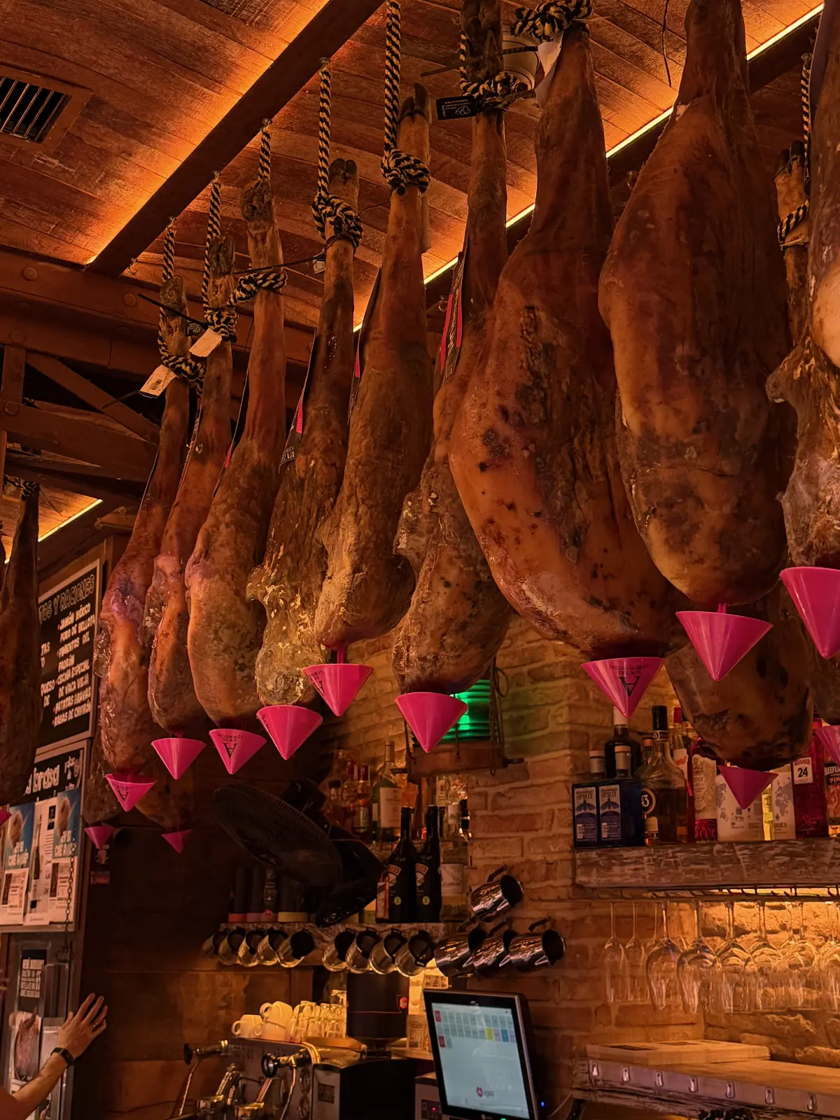Iberian hams hanging from the ceiling at Asador Erretegia
