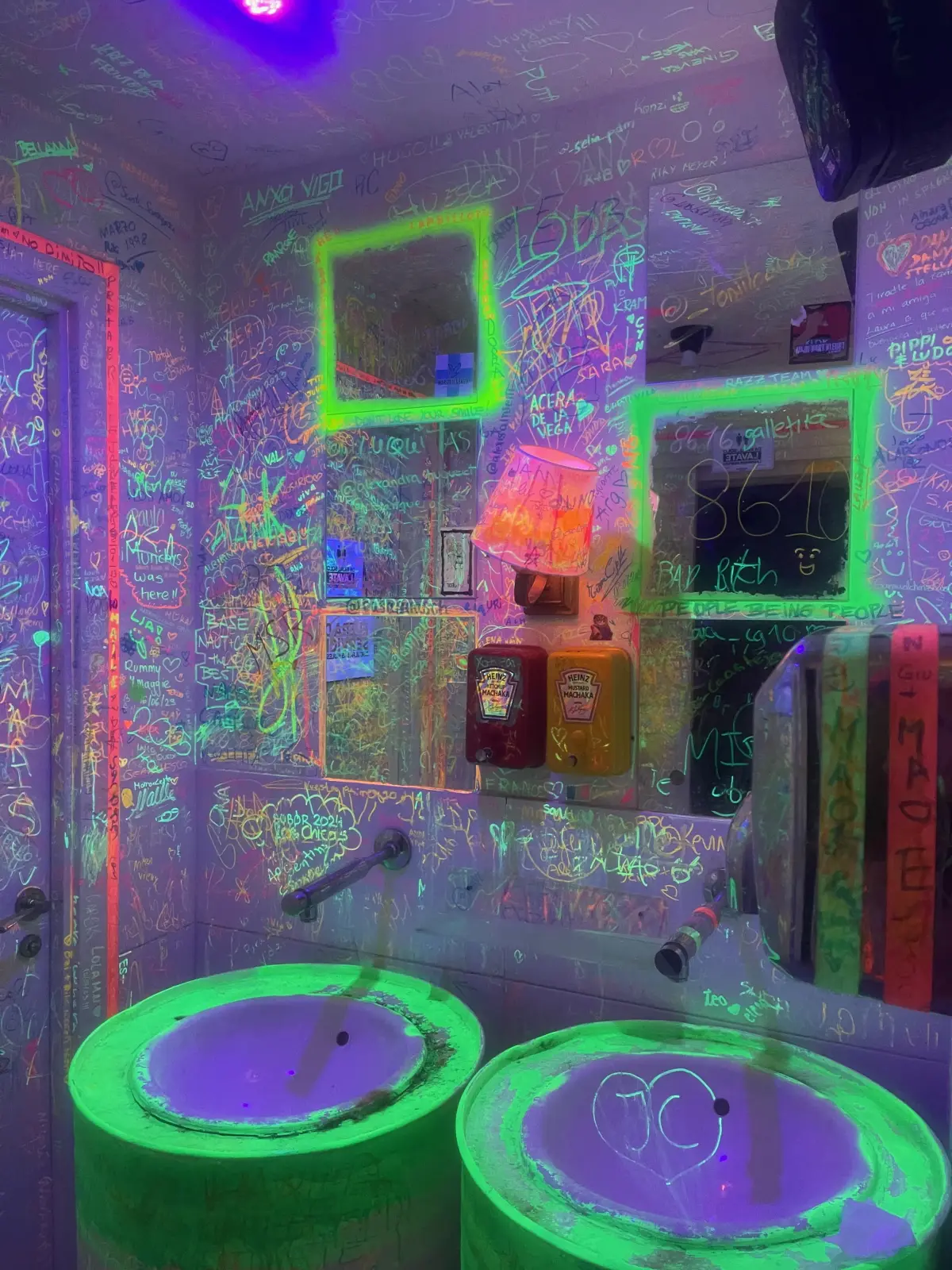 The neon-lit bathroom at Machaka SmashBurger