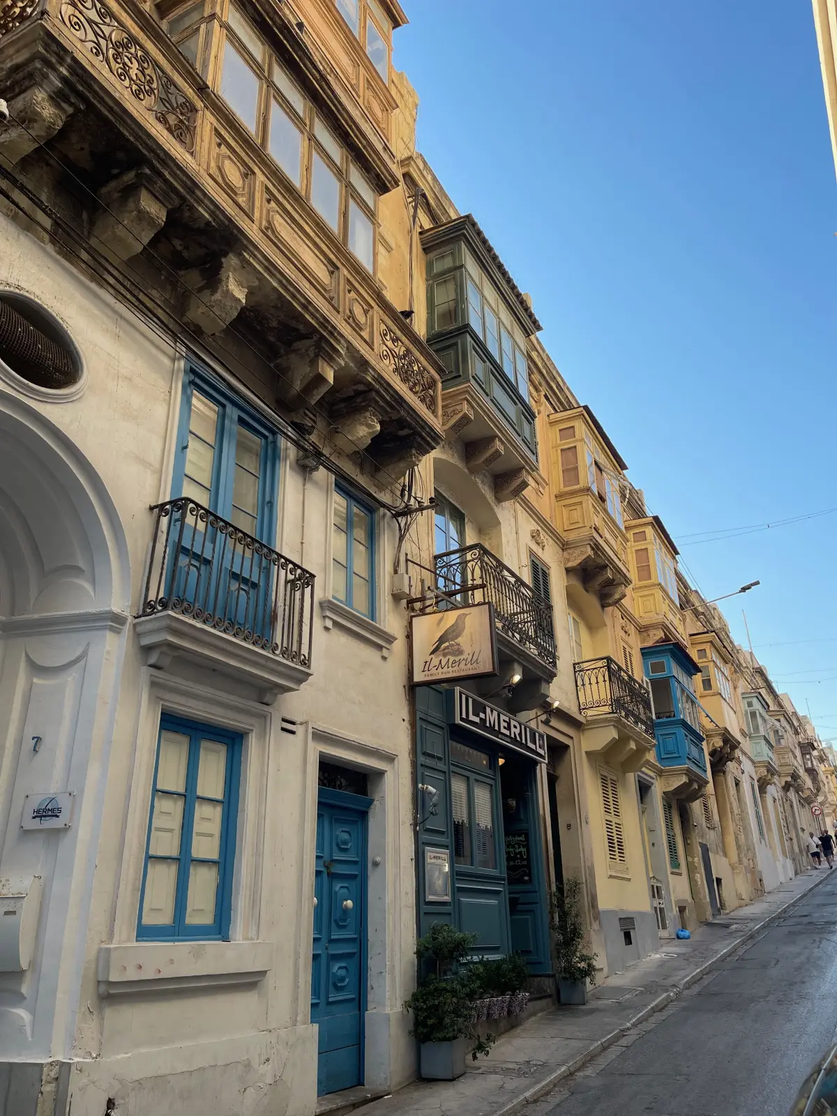 Traditional balconies on a street in Sliema
