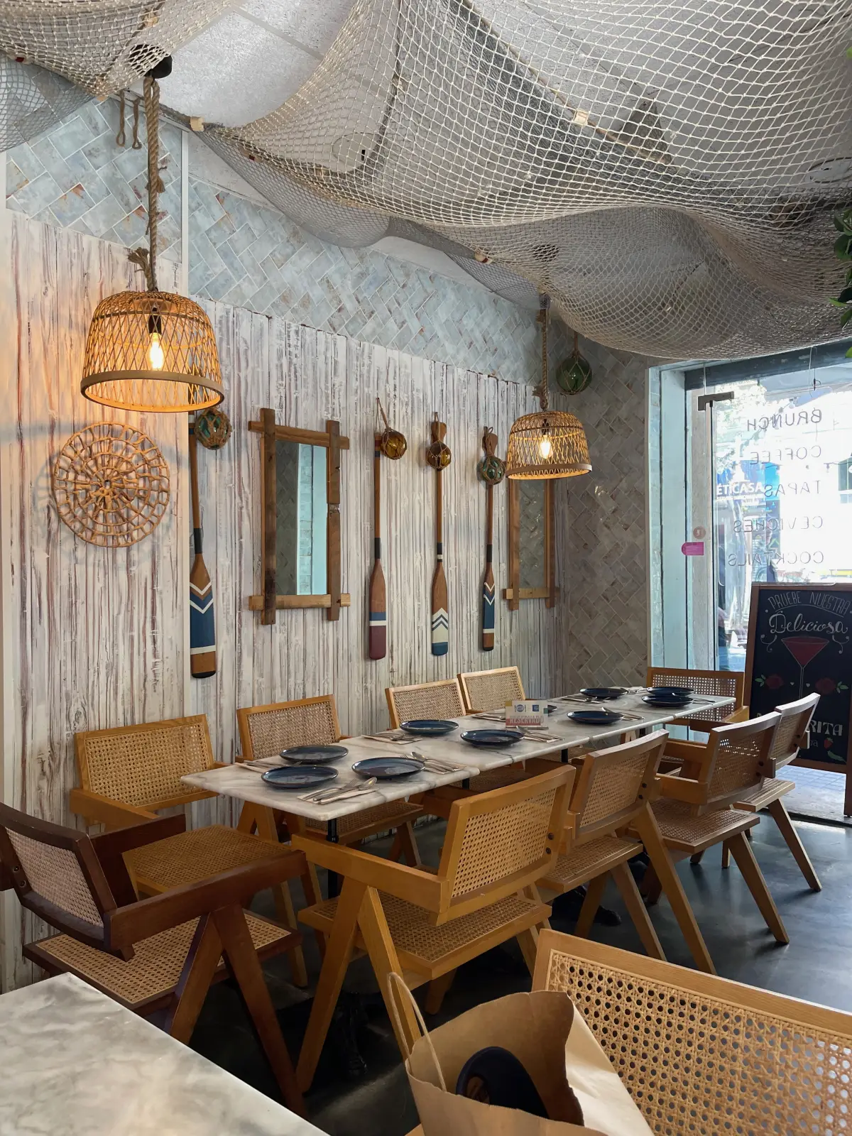 The nautical interior of Sr. Ceviche with fishing nets and oars